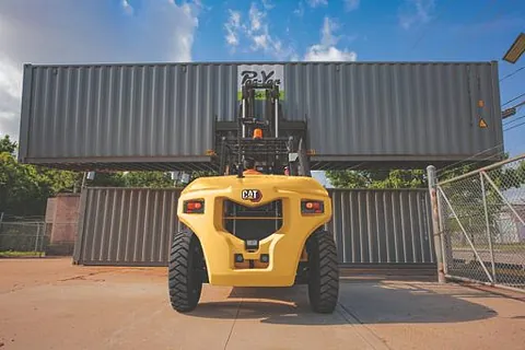 Forklift lifting heavy containers